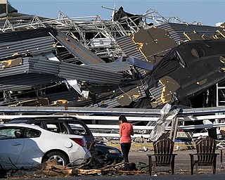 Annina Purdy, who was inside the Lowe's hardware store in Sanford, N.C. the previous day when a tornado destroyed the building, returned to the store's parking lot on Sunday, April 17, 2011, to reclaim personal belongings from her car.