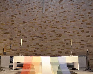 The altar at Christ Episcopal Church, 2627 Atlantic St. NE, Warren, is draped with banners of color for the Maundy Thursday service at 7 tonight that will feature the cantata “Colors of Grace.” The Rev. Donna Maree, rector, said white represents God’s grace. The banners will be removed in the stripping of the altar.