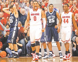 Ohio State's Jared Sullinger (0) reacts after scoring a basket as Penn State's Billy Oliver (35), Cammeron Woodyard (25) and Ohio State's William Buford (44) look on in the closing second of the second half of an NCAA college basketball game Saturday, Jan. 15, 2011, in Columbus, Ohio. Ohio State won 69-66.