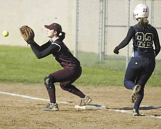 Liberty’s first baseman Julie Mickulich catches the ball to make the play before Brookfield’s Haley Hogue can reach the base during the first inning of Thursday’s game in Liberty. The Warriors defeated the Leopards, 8-4.