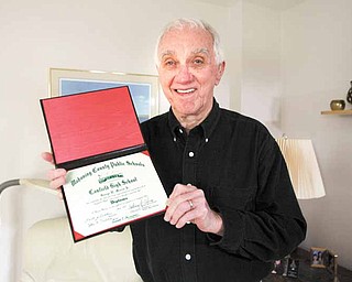 George Morris is a World War II veteran who just received his high-school diploma from the Canfield Board of Education. Morris joined the Army Air Corps before his senior year of high school and never graduated.