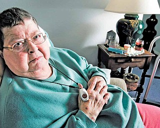 Shirley Saathoff uses a small panic-button pendant and two-way communication system for her tidy Lee's Summit home. "It's a godsend, honey," said the 72-year-old woman of the device that provides 24-hour monitoring.