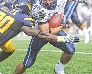 Villanova's Angelo Babbaro (22) looks to run by West Virginia's Franchot Allen (20) during the second quarter of a football game Saturday, Aug. 30, 2008 in Morgantown, W.Va.