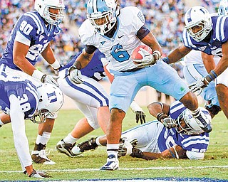 North Carolina's Anthony Elzy (6) steps into the end zone to score a touchdown in the first quarter against Duke during an NCAA college football game Saturday, Nov. 27, 2010, in Durham, N.C.
