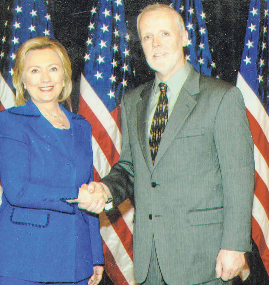 Secretary of State Hillary Clinton greets Ron Elkins, a Poland native who retired and returned to the Mahoning Valley after 23 years as a foreign service officer. Clinton was Elkins’ 
former boss.