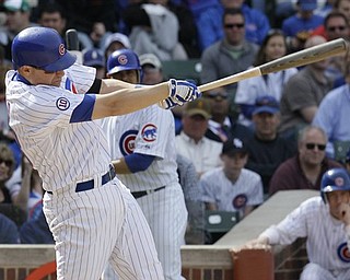 Chicago Cubs' Jeff Baker hits a two-run double against the Los Angeles Dodgers during the eighth inning of a baseball game on Saturday, April 23, 2011, in Chicago.