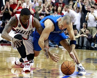 Portland Trail Blazers' Wesley Matthews, left, knocks the ball away from Dallas Mavericks' Jason Kidd , right, in the fourth quarter of Game 4 of their NBA basketball first-round playoff series on Saturday, April 23, 2011, in Portland, Ore. The Trail Blazers defeated the Mavericks 84-82.