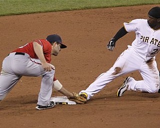 Washington Nationals shortstop Danny Espinosa, left, tags Pittsburgh Pirates' Andrew McCutchen as he tries to steal  second in the sixth inning of the baseball game, Saturday, April 23, 2011, in Pittsburgh. McCutchen was called safe and came around to score as the Pirates won 7-2.