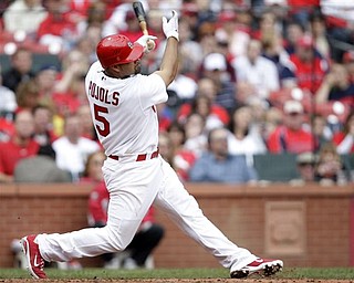 St. Louis Cardinals' Albert Pujols (5) connects for a solo home run in the sixth inning of a baseball game against the Cincinnati Reds, Saturday, April 23, 2011, in St. Louis. The Reds defeated the Cardinals 5-3. 