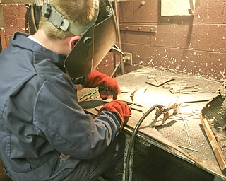 ROBERT K. YOSAY | THE VINDICATOR..Michael Cherol test welds two pieces of metal - .-30-