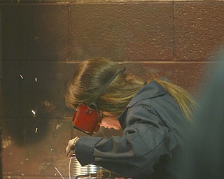 ROBERT K. YOSAY | THE VINDICATOR..Taralynn Gilkinson a senior  gas welds a piece of metal as part of her class project in Mr Bob Day's Welding Class - ..-30-