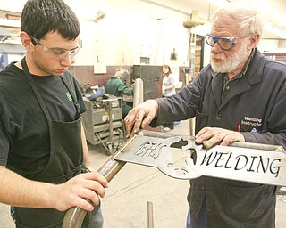 ROBERT K. YOSAY | THE VINDICATOR..Checking a weld on a Canfield Fair Bench Michael Cherol and Bob Day -  The industrial arts program has made and supplied over a 100 benches for the Canfield Fairgrounds -  ..-30-