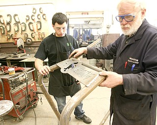 ROBERT K. YOSAY | THE VINDICATOR..Checking a weld on a Canfield Fair Bench Michael Cherol and Bob Day -  The industrial arts program has made and supplied over a 100 benches for the Canfield Fairgrounds -  ..-30-