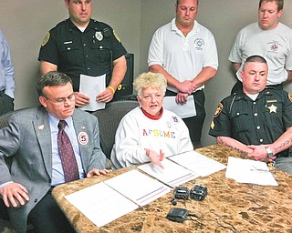 Gary Carlile, left, regional director for We Are Ohio; Joann Johntony, center, state president of the Ohio Association of Public School Employees/American Federation of State, County and Municipal Employees; and Mahoning County Sgt. and Fraternal Order of Police President T.J. Assion; all discussed their support Monday afternoon for a Senate Bill 5 referendum at a press conference called by Mahoning County Democratic Party Chairman David Betras. 
