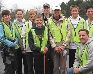 Clean-spirited club members: Members of the Rotary Club of Austintown joined forces with the Fitch Interact Club for a semiannual cleaning of Kirk Road from Route 46 to Whispering Pines Drive, which is about 11⁄2 miles. The task has been undertaken twice a year for the past 10 years. The weather was cold and damp, but the volunteers kept up their spirit for improving the community. They are, standing, from left, Hillary Prestridge, Kaitlin Choma, Tina Kubacki, Todd Kubacki, Brian Laraway, Heather Fronk, David Dalvin and Dr. Mitch Dalvin; and kneeling is Gary Reel.