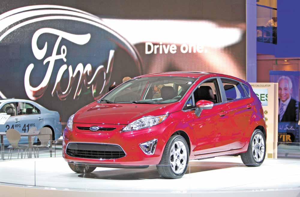 In this Jan. 11, 2010 file photo, a 2011 Ford Fiesta is displayed at the North American International Auto Show, in Detroit. Ford posted its best first-quarter profit in 13 years, as its new, more fuel-efficient vehicles reached showrooms during a surge in gasoline prices. New arrivals such as the Ford Explorer and Fiesta small car are selling well.