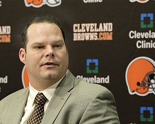 FILE - This Jan. 14, 2011, file photo shows Cleveland Browns general manager Tom Heckert at a news conference at the Browns training facility in Berea, Ohio.  With wide receiver and defensive linemen a priority, the Cleveland Browns enter the NFL draft with the No. 6 overall pick and three selections in the Top 70. 