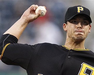 Pittsburgh Pirates pitcher Charlie Morton throws in the first inning of a baseball game against the San Francisco Giants in Pittsburgh on Tuesday, April 26, 2011.
