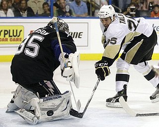Pittsburgh Penguins center Maxime Talbot (25) is stopped by Tampa Bay Lightning goalie Dwayne Roloson (35) during the third period in Game 6 of a first-round NHL Stanley Cup playoff series Monday, April 25, 2011 in Tampa, Fla. 