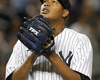 New York Yankees starting pitcher Ivan Nova looks to the sky while coming off the mound in the seventh inning after manager Joe Girardi took him out of the baseball game against the Chicago White Sox at Yankee Stadium on Tuesday, April 26, 2011, in New York.