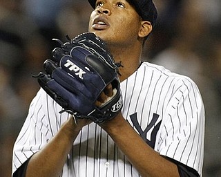 New York Yankees starting pitcher Ivan Nova looks to the sky while coming off the mound in the seventh inning after manager Joe Girardi took him out of the baseball game against the Chicago White Sox at Yankee Stadium on Tuesday, April 26, 2011, in New York. 