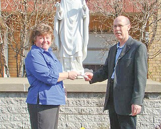 Making them aware: Because it cares about children in the community, Hubbard Optimist Club has been donating money to support various drug awareness programs for students in Hubbard schools for the past 15 years. Ray Wright, Optimist president, continued the tradition recently by presenting a check for $225 to Cindy Lacko, principal at St. Patrick School, where the funds will be used to support the drug awareness programs.