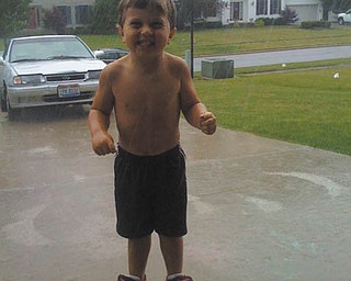 Melina Fusillo of Canfield calls our attention to the pure joy on the face of her nephew, Dominic Gizzi of Canfield, who was 3 1/2 at the time this picture was taken of him playing outside in a warm summer rain in 2010.