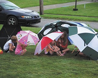 A rainy Memorial Day picnic last year at Diane Brookbank’s house in Girard didn’t dampen the spirits of these creative guests.