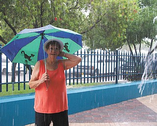 Ruth Burns of Poland thought a trip would get her away from the Ohio rain. However, the rain followed her all the way to the Bahamas, yet she kept on smiling! Photo submitted by her daughter, Laurie Fox of Lowellville.