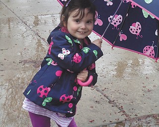 Carley Johnston, 5, of Poland had a great time playing outside in  the drizzle during a recent April shower. She loved wearing her  matching rain gear! Photo taken by her mom, Cara Johnston.