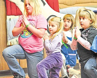 North East Ohio Girl Scouts practice yoga poses at the Expo. Healthy lifestyles and keeping fit were among the issues addressed in its workshops.