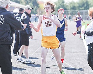 Ryan Roush of South Range crosses the finish line to win the second section boys 3200 meter run finals at the 16th Poland Invitation Track & Field Meet Saturday.