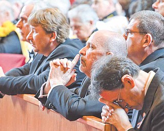 From left to right: Mike Terry Daprile of Boardman, Norman Weimer Sr. of Youngstown, Frank Prato of Poland, Jack Thompson of Vienna and Ronald Ingalls of Northfield, pray during a service conferring them from 3rd to 4th degree masons at St. Charles in Boardman Saturday afternoon.