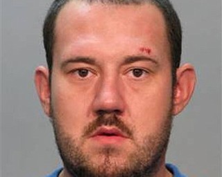 This photo provided by Columbus, Ohio, police, shows a booking photo of Randle Lee Roberts II. Authorities in central Ohio have identified the man killed in a shootout with police that left four people injured, including three officers. Columbus police identified him as 27-year-old Randle Lee Roberts II. They didn't say where he lives. They learned after the shootout Saturday that Roberts might be a suspect in a quadruple homicide about 90 miles south in Adams County at a house along a rural state highway near the village of West Union. An Adams County dispatcher confirms the sheriff's office is investigating the four deaths but hasn't released details.