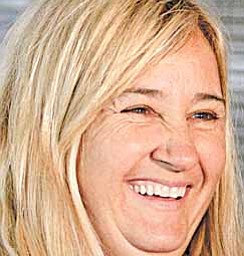 In this photo taken April 24, 2011, trainer Kathy Ritvo reacts to a question about her Kentucky Derby hopeful Mucho Macho Man after the colt worked over a muddy track at Churchill Downs in Louisville, Ky.