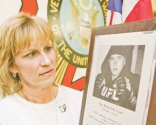 Christine Wortman’s son, Army Sgt. Robert “Robbie” Michael Carr, a 2002 Champion High School graduate, was killed in Iraq on March 13, 2007. She says her son would have been proud that the military killed Osama bin Laden. The photo was taken Monday at Veterans of Foreign Wars Post 3332 in Newton Falls, where she works.