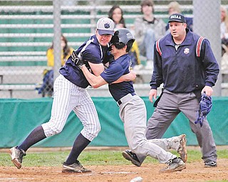 Lowellville’s Louie Lebron (15) runs into Leetonia pitcher Lance Tullis (7) as he tries to score on a wild throw to home that Tullis misplayed during an Inter Tri-County League Tier Two game Monday at Cene Park in Struthers. The Rockets downed the Bear, 5-0.