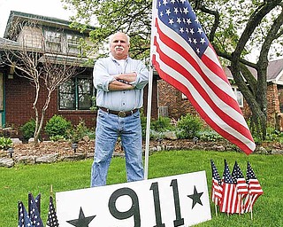 Billy Frease set up a 9/11 memorial Monday in front of his South Side home, the day after it was
announced Osama bin Laden had been killed by U.S. troops. Frease made the sign to commemorate the
five-year anniversary of the attacks but decided to save it for the day bin Laden was captured or killed.
