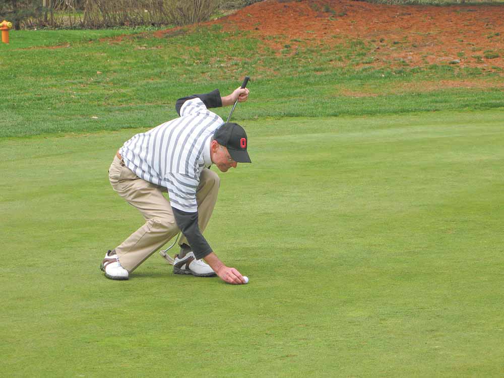 Frank Bellino of Liberty lines up a shot on Stambaugh’s venerable No. 1 hole. 
