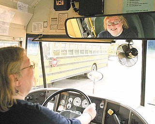 Pam Spears, a bus driver for Austintown schools, readies her bus after having a thank-you lunch for School Bus Drivers Appreciation Day. Spears has been a full-time driver for eight years and said she enjoys spending time with her coworkers before their early morning shifts.
