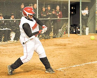 Sarah Ingalls shortens up her swing to drive a pitch during a YSU softball game. Sarah, who is distantly related to “Little House on the Prairie” author Laura Ingalls Wilder, said the hardest part about a prairie lifestyle would be giving up modern conveniences such as Facebook.