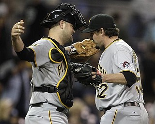 Pittsburgh Pirates closer Joel Hanrahan gets a hug from catcher Chris Snyder after closing out the Pirates 4-3 victory over the San Diego Padres in a baseball game Monday, May 2, 2011 in San Diego.
