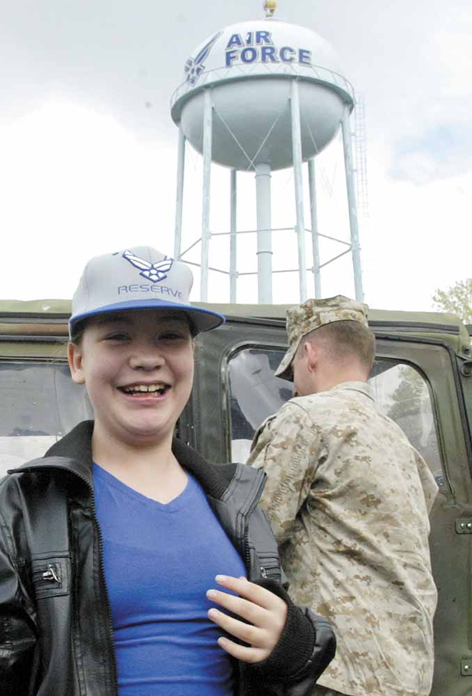 Ashley Moorhead is all smiles in anticipation of a day of activities, including being taxied in a C-130 Hercules cargo plane.