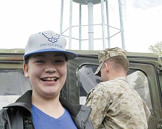Ashley Moorhead is all smiles in anticipation of a day of activities, including being taxied in a C-130 Hercules cargo plane.