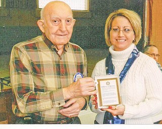 A Rotarian welcome: Struthers Rotary Club recently welcomed its newest member, Darla Shobel. Charter member Paul Paris presents Shobel with her Object of Rotary plaque. She is a scheduling coordinator for Comfort Keepers and has lived in Struthers for the past 16 years.