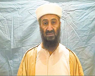 In this undated image taken from video provided by the U.S. Department of Defense, a man who the American government says is Osama bin Laden speaks in a video released on Saturday, May 7, 2011. The videos show bin Laden watching himself on television and rehearsing for terrorist videos.