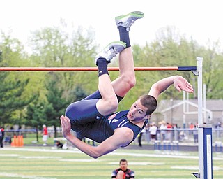 Austintown Fitch junior jumper Jay Jakovina clears the high-jump bar at 6-foot-8 to win the gold medal in the event at the 31st-annual Optimist meet at Fitch’s Falcon Stadium. Mahoning Valley athletes earned top-three
finishes in 32 events.