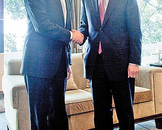 FILE - In this March 31, 2011, file photo U.S. Treasury Secretary Timothy Geithner, left, shakes hands with Chinese Vice Premier Wang Qishan prior to having lunch on the sidelines of the G-20 High Level Seminar on the international monetary system in Nanjing, China. Five years and one financial crisis since the United States and China commenced regular high-level economic talks, fast-growing Beijing might have the upper hand in the latest round of discussions which start Monday, May 9, 2011, between the world's two biggest economies. At the Strategic and Economic Dialogue Geithner and Secretary of State Hillary Clinton will head the U.S. team and Qishan, a top economic policymaker, will head the Chinese team.