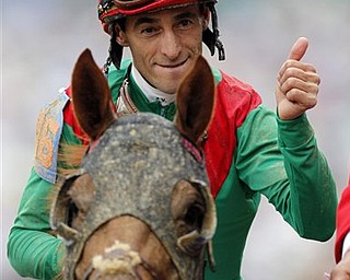 John Velazquez riding Animal Kingdom reacts after winning the 137th Kentucky Derby horse race at Churchill Downs Saturday, May 7, 2011, in Louisville, Ky.