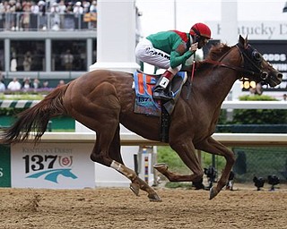 John Velazquez rides Animal Kingdom to victory during the 137th Kentucky Derby horse race at Churchill Downs Saturday, May 7, 2011, in Louisville, Ky.
